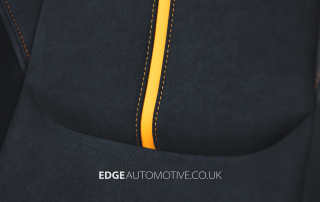 Finished leather and Alcantara car seat reupholstery close-up